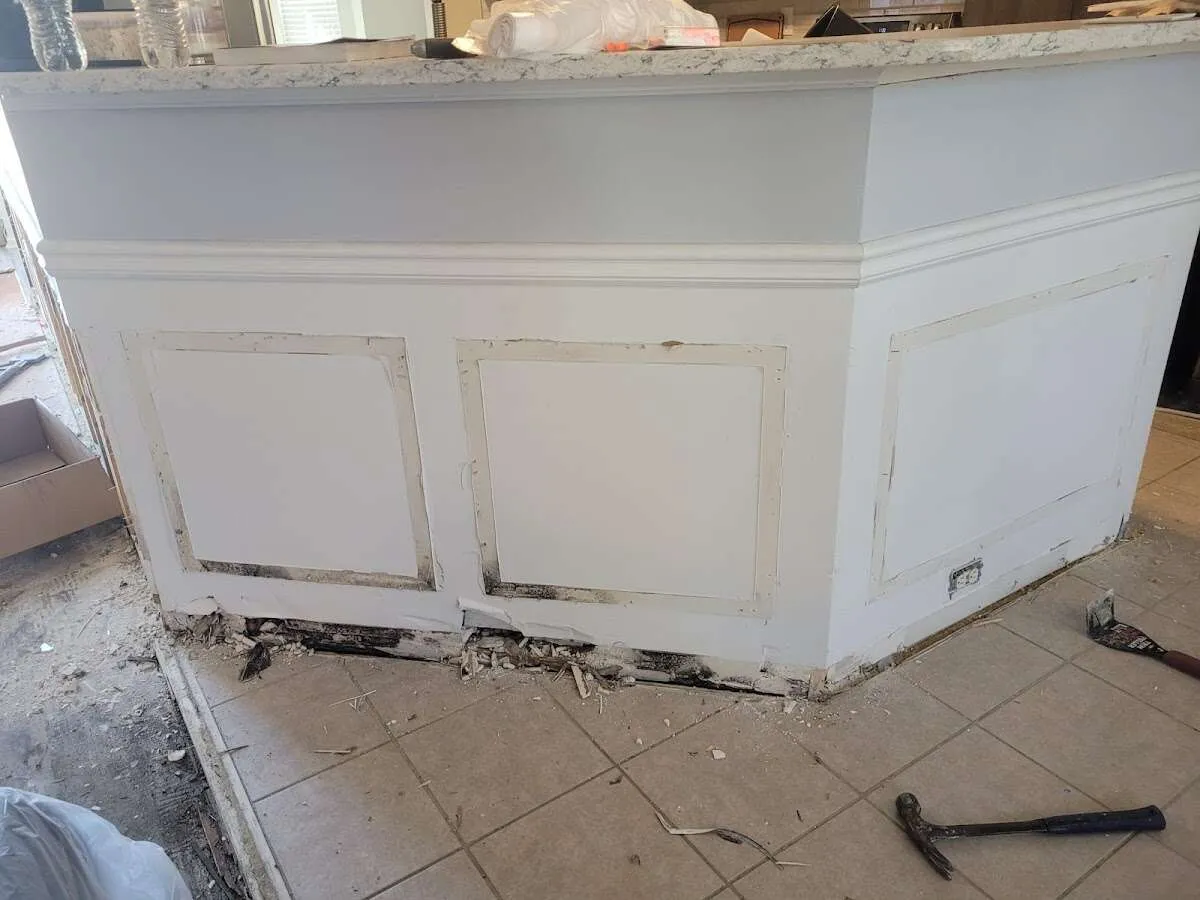 Water damage and mold on kitchen during Storm Damage Restoration in Old Westbury